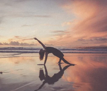 sunrise yoga woman on beach